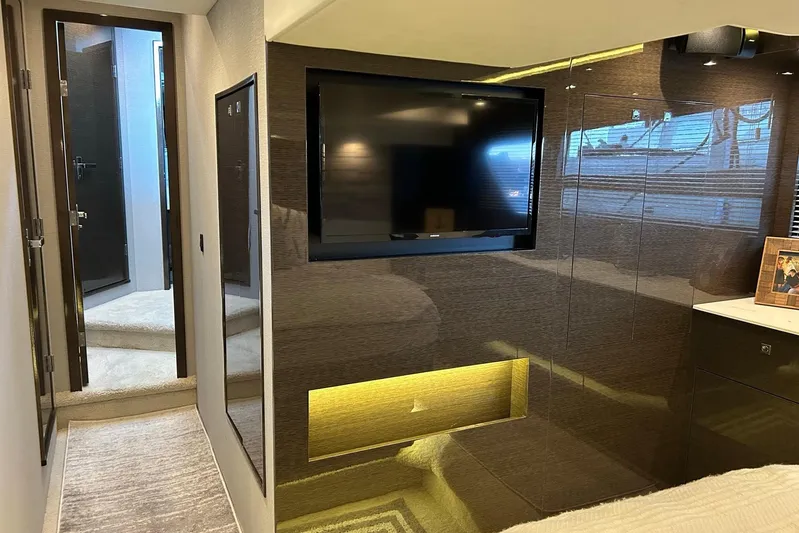 2021 Cruisers Yachts 50 Cantius Yacht Photos Pics Luxurious interior of 2021 Cruisers Yachts 50 Cantius with modern TV and elegant decor.