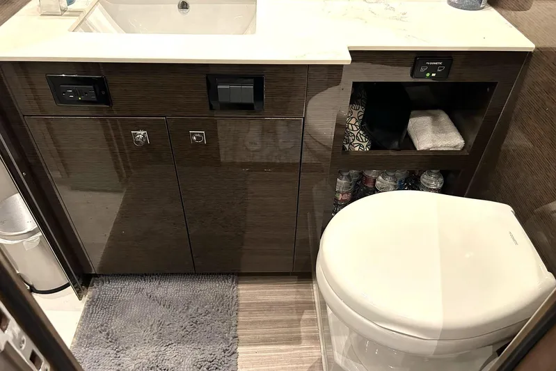 2021 Cruisers Yachts 50 Cantius Yacht Photos Pics Luxury bathroom in 2021 Cruisers Yachts 50 Cantius with modern fixtures and storage.