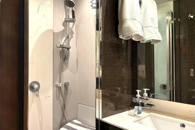 2021 Cruisers Yachts 50 Cantius Yacht Photos Pics Luxurious bathroom in 2021 Cruisers Yachts 50 Cantius, featuring modern shower and sink.