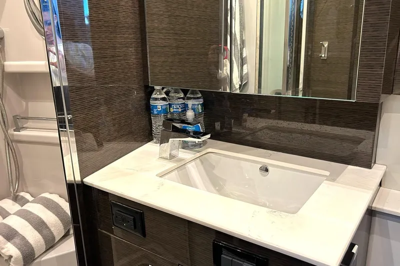 2021 Cruisers Yachts 50 Cantius Yacht Photos Pics Luxurious bathroom vanity in 2021 Cruisers Yachts 50 Cantius with modern sink and mirror.