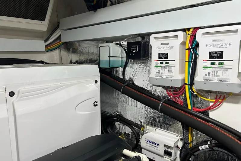 2021 Cruisers Yachts 50 Cantius Yacht Photos Pics Engine room of 2021 Cruisers Yachts 50 Cantius with battery chargers and wiring.