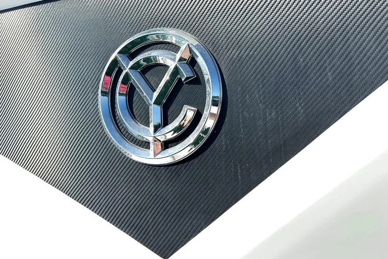 2021 Cruisers Yachts 50 Cantius Yacht Photos Pics Chrome logo on 2021 Cruisers Yachts 50 Cantius, textured black background.