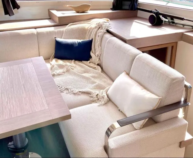 Elba 45 Yacht Photos Pics Luxurious interior of 2021 Fountaine Pajot Catamaran Elba 45 with cozy seating and cushions.