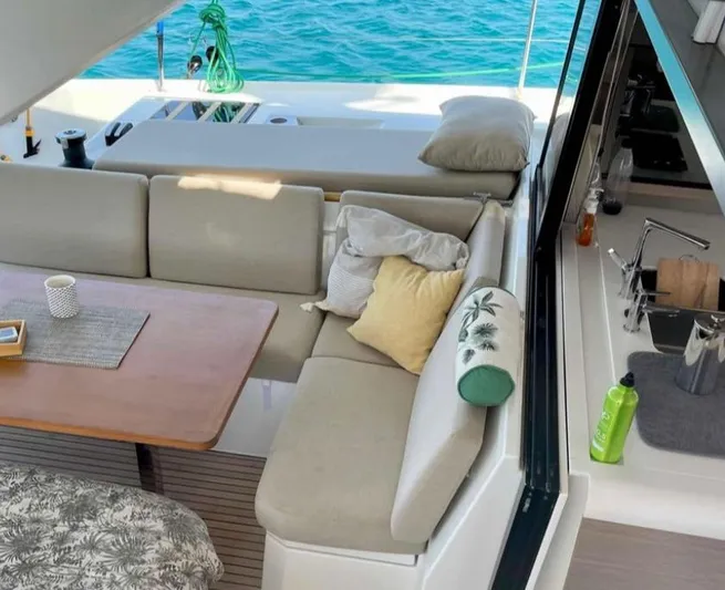 Elba 45 Yacht Photos Pics Luxurious 2021 Fountaine Pajot Catamaran Elba 45 interior with cozy seating and ocean view.