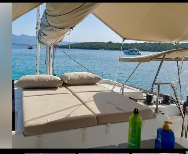 Elba 45 Yacht Photos Pics 2021 Fountaine Pajot Catamaran Elba 45 with sunbathing area on tranquil water.