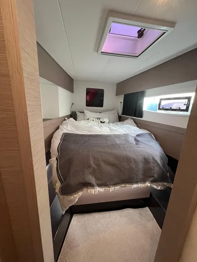 Elba 45 Yacht Photos Pics Interior cabin of 2021 Fountaine Pajot Catamaran Elba 45 with cozy bed and skylight.