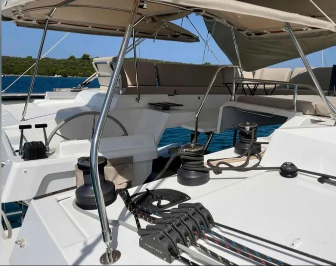 Elba 45 Yacht Photos Pics 2021 Fountaine Pajot Catamaran Elba 45 deck with seating and sailing equipment.