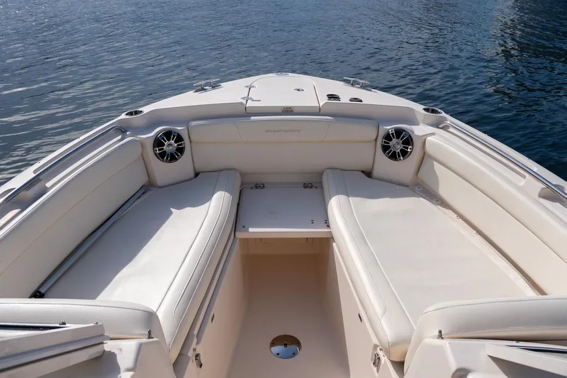  Yacht Photos Pics 2022 Grady-White Freedom 285 boat interior with spacious seating and water view.
