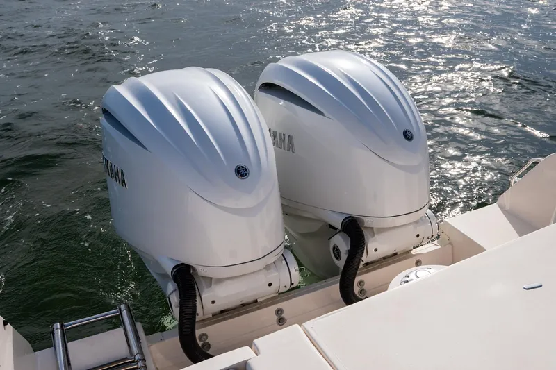  Yacht Photos Pics Twin Yamaha outboard engines on a 2022 Grady-White Freedom 285 boat in water.