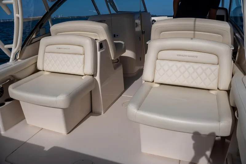  Yacht Photos Pics 2022 Grady-White Freedom 285 boat interior with luxurious white seating.