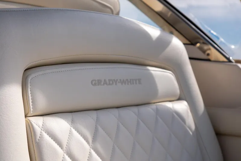  Yacht Photos Pics Luxurious interior of 2022 Grady-White Freedom 285 boat with quilted leather seating.