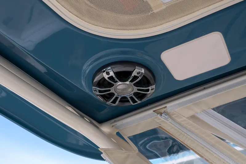  Yacht Photos Pics 2022 Grady-White Freedom 285 boat interior with speaker and canopy detail.