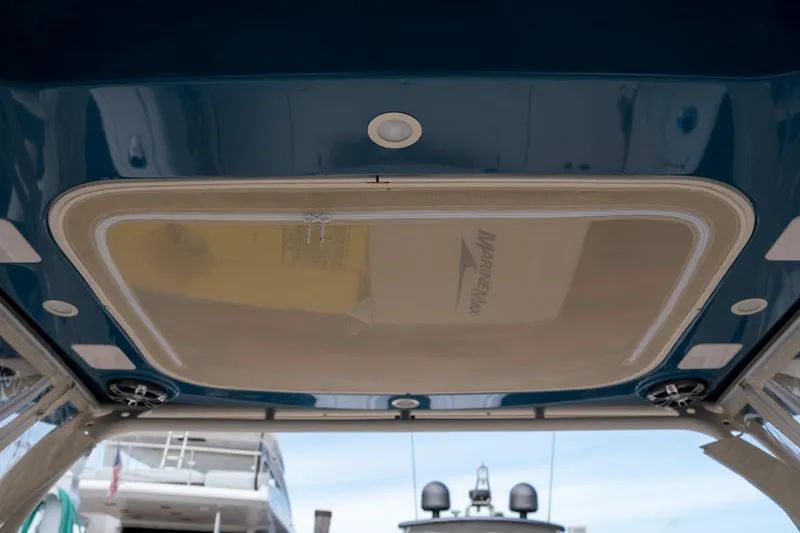  Yacht Photos Pics 2022 Grady-White Freedom 285 boat interior ceiling view with speakers and hatch.