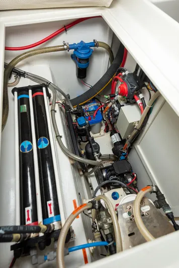 Diversion Yacht Photos Pics Engine compartment of a 2015 Custom Mcat 52, showcasing mechanical components and wiring.