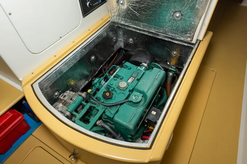 Diversion Yacht Photos Pics Engine compartment of a 2015 Custom Mcat 52, showcasing a green marine engine.