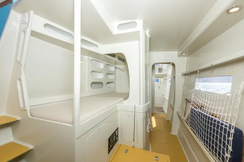 Diversion Yacht Photos Pics Interior of 2015 Custom Mcat 52 catamaran, featuring bunk beds and modern design.