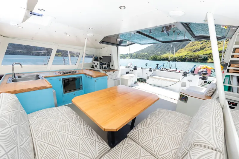Diversion Yacht Photos Pics Interior of 2015 Custom Mcat 52 yacht with modern kitchen and scenic view.