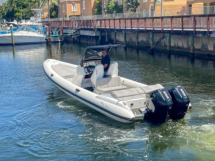  Yacht Photos Pics 2025 Ribco Venom 30 boat with dual engines cruising in a marina.