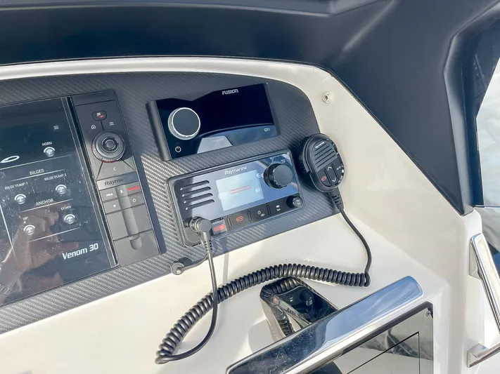  Yacht Photos Pics Control panel of 2025 Ribco Venom 30 boat with communication equipment.