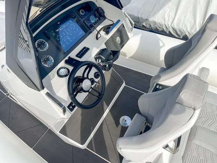  Yacht Photos Pics 2025 Ribco Venom 30 boat cockpit with modern controls and dual seating.