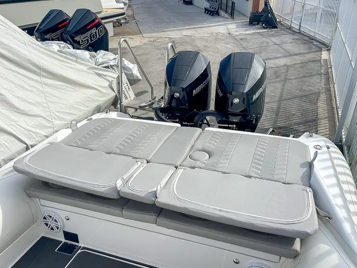  Yacht Photos Pics 2025 Ribco Venom 30 boat with dual outboard engines and cushioned seating.