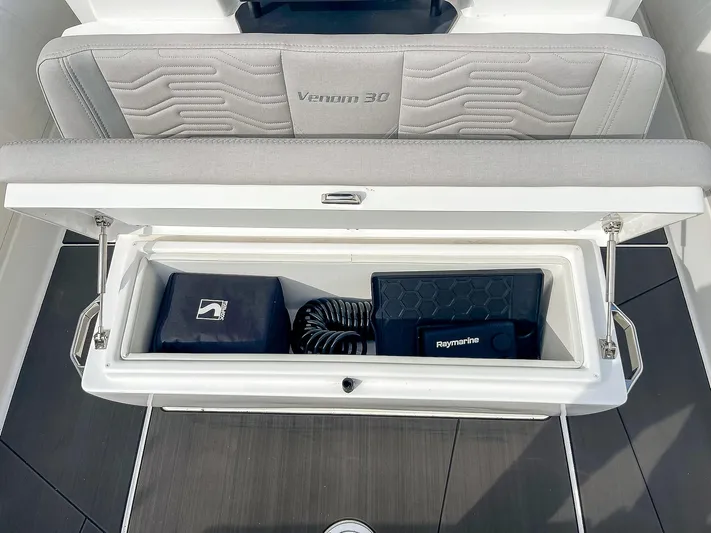  Yacht Photos Pics 2025 Ribco Venom 30 boat storage compartment with accessories and equipment.