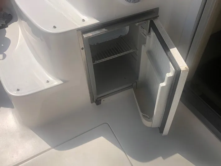 Hat Trick Yacht Photos Pics Open mini fridge on 2003 Sea Ray 400 Sedan Bridge yacht deck.