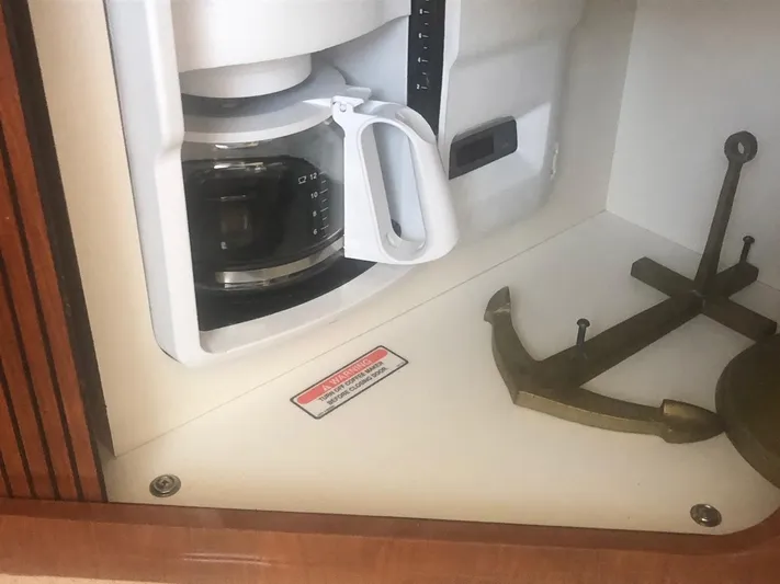 Hat Trick Yacht Photos Pics Coffee maker and anchor inside a 2003 Sea Ray 400 Sedan Bridge yacht.