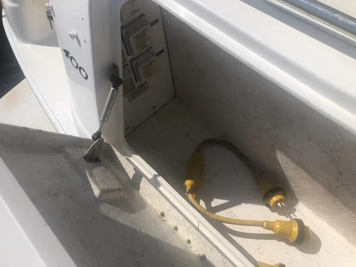 Hat Trick Yacht Photos Pics 2003 Sea Ray 400 Sedan Bridge power connections and storage compartment.