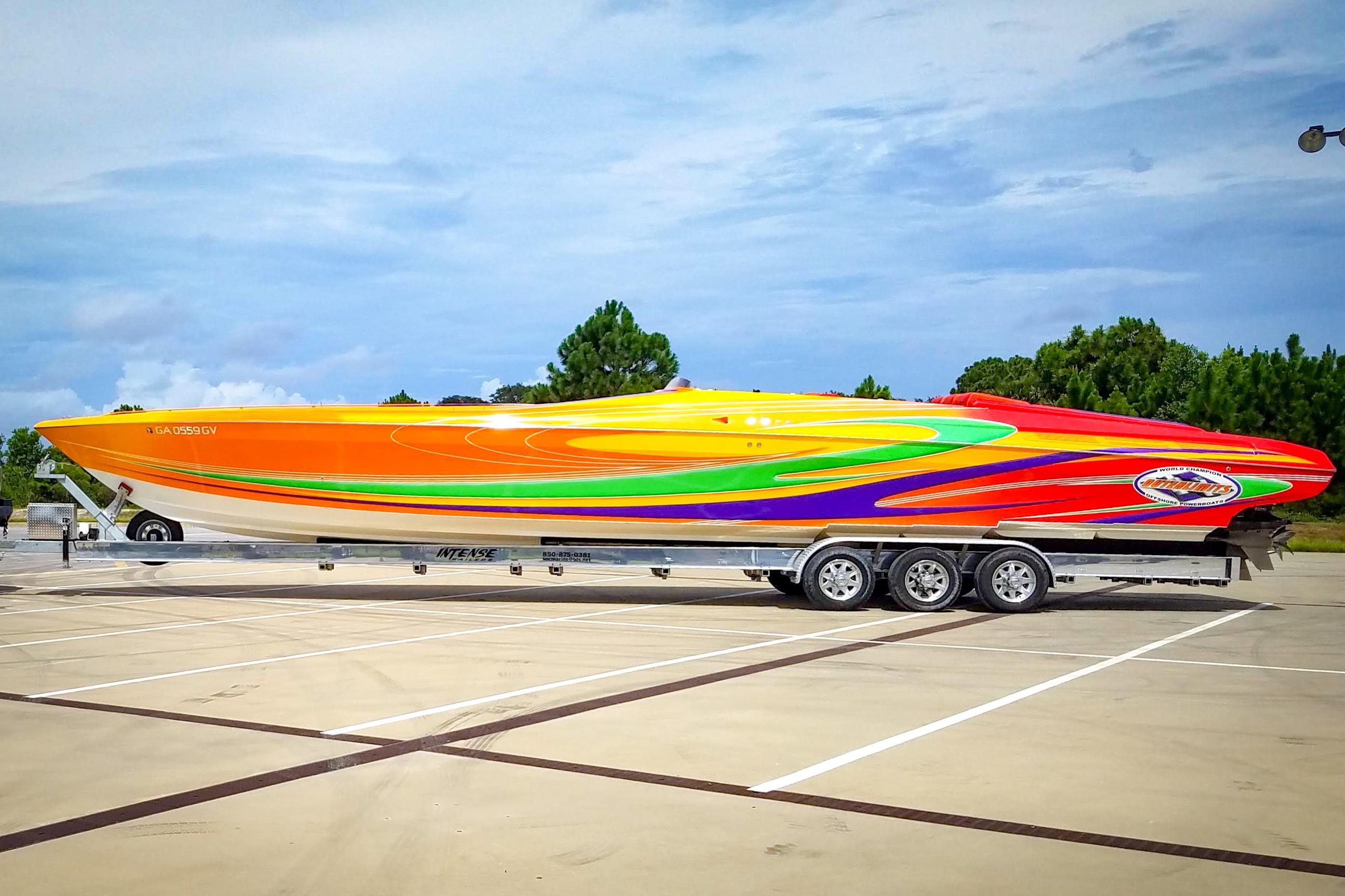 2005 Outerlimits 51 Sport Yacht with vibrant multicolor design on a trailer.