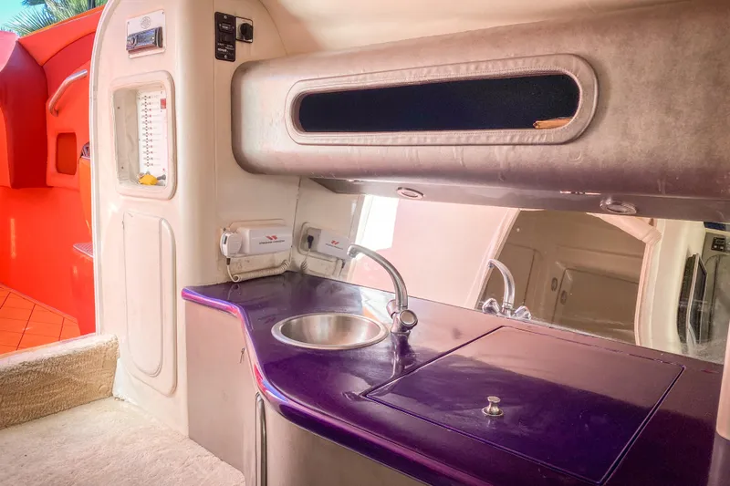  Yacht Photos Pics Interior of 2005 Outerlimits 51 Sport Yacht with sleek kitchenette and modern design.