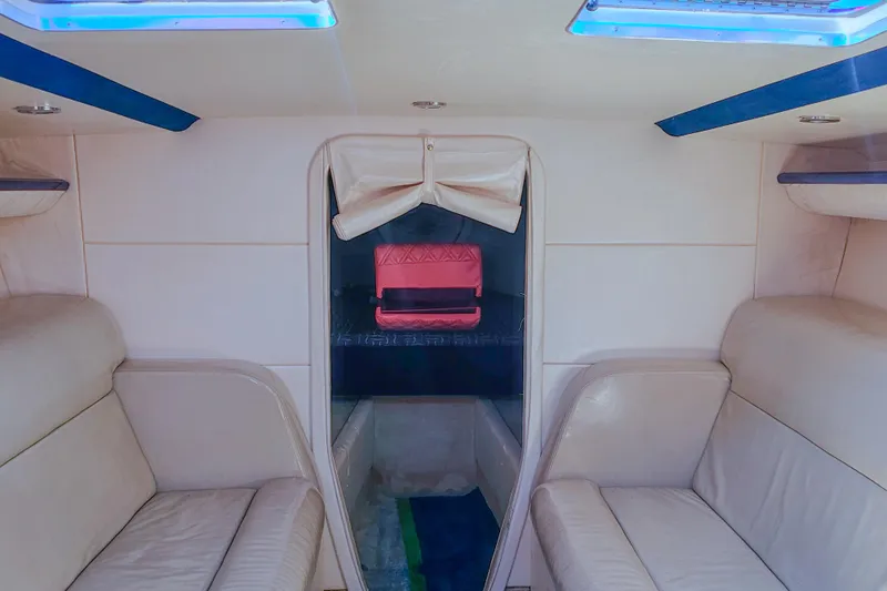  Yacht Photos Pics Interior of 2005 Outerlimits 51 Sport Yacht with beige seating and skylights.