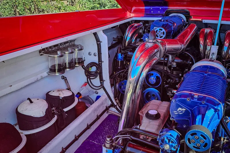  Yacht Photos Pics Engine compartment of a 2005 Outerlimits 51 Sport Yacht with polished components.