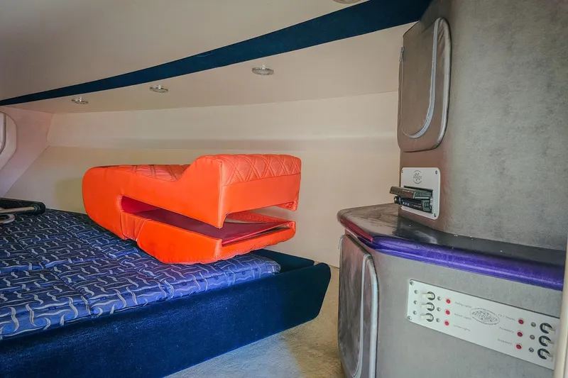  Yacht Photos Pics Interior of 2005 Outerlimits 51 Sport Yacht with vibrant orange seating and modern controls.