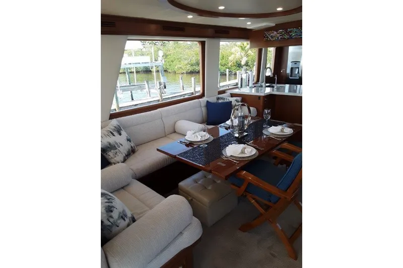 Endless Summer Yacht Photos Pics Luxurious interior of 2008 Offshore Yachts 62 Flushdeck, featuring elegant dining area