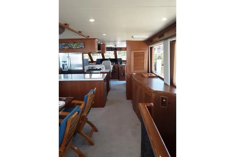 Endless Summer Yacht Photos Pics Luxurious interior of 2008 Offshore Yachts 62 Flushdeck, featuring elegant wood finishes and modern amenities.