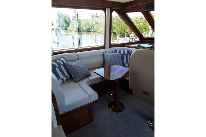 Endless Summer Yacht Photos Pics Interior by the inside helm with cozy seating and table