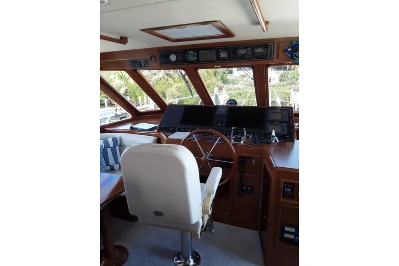 Endless Summer Yacht Photos Pics Inside helm with modern navigation equipment and comfortable seating.