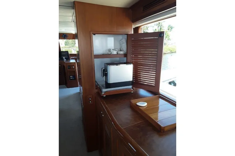 Endless Summer Yacht Photos Pics Space saving cabinet with built-in coffee machine.