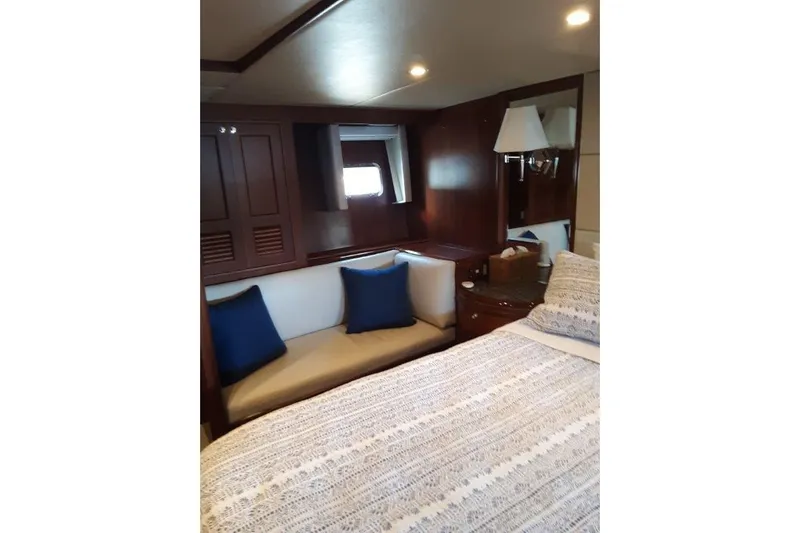 Endless Summer Yacht Photos Pics Master stateroom couch with cozy seating and elegant decor.