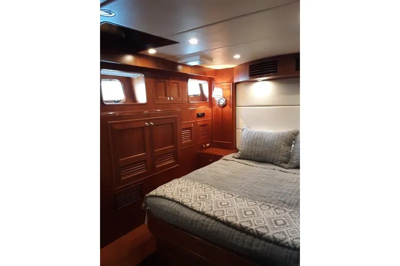 Endless Summer Yacht Photos Pics Luxurious cabin interior of 2008 Offshore Yachts 62 Flushdeck with elegant wood paneling.