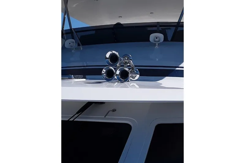 Endless Summer Yacht Photos Pics 2008 Offshore Yachts 62 Flushdeck yacht with chrome air horns on deck.
