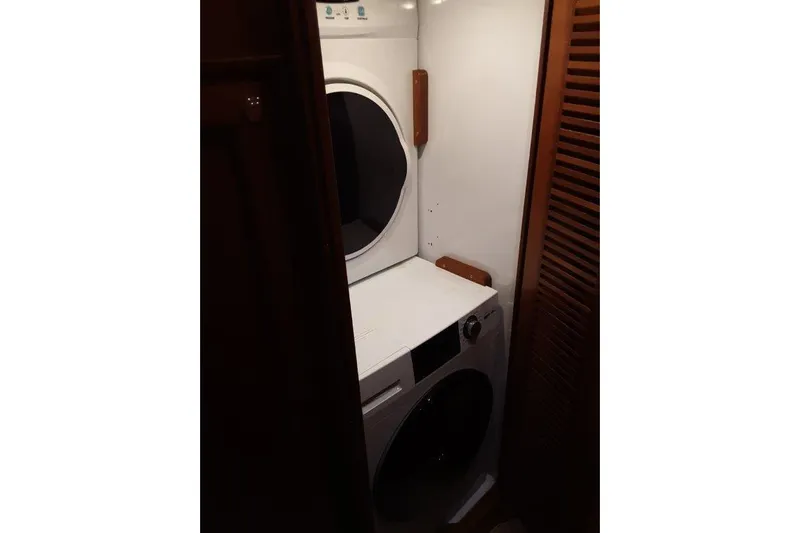 Endless Summer Yacht Photos Pics Laundry area with stacked washer and dryer in 2008 Offshore Yachts 62 Flushdeck.
