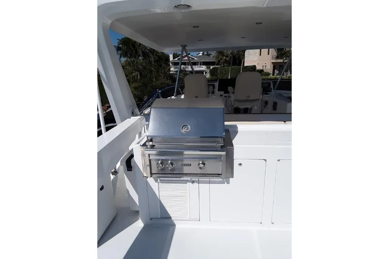 Endless Summer Yacht Photos Pics Outdoor grill on the Flybridge of 2008 Offshore Yachts 62 Flushdeck, featuring sleek stainless steel design.