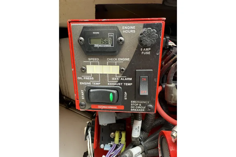 Ghost Yacht Photos Pics Control panel of a 2012 Everglades 350LX boat, featuring engine hours and emergency stop.