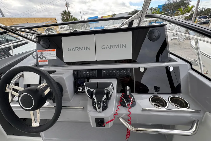  Yacht Photos Pics 2025 Jeanneau Leader 10.5 WA Series 2 helm with Garmin displays and modern controls.