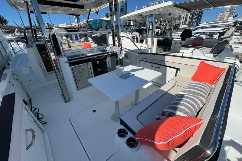  Yacht Photos Pics 2025 Jeanneau Leader 10.5 WA Series 2 boat interior with seating and table.