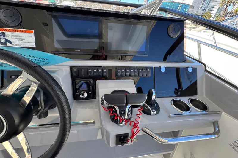  Yacht Photos Pics 2025 Jeanneau Leader 10.5 WA Series 2 helm with modern controls and dual displays.