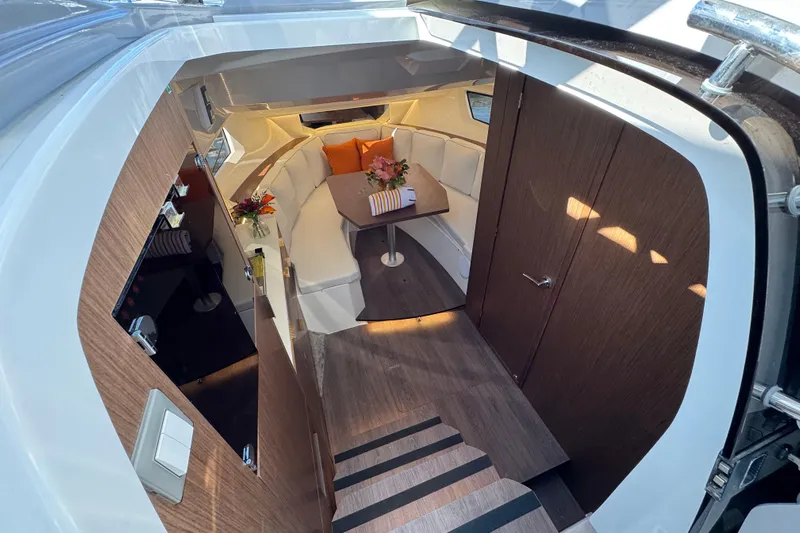  Yacht Photos Pics Luxurious interior of 2025 Jeanneau Leader 10.5 WA Series 2 boat, featuring elegant seating and decor.