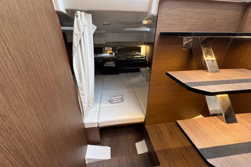  Yacht Photos Pics Interior of 2025 Jeanneau Leader 10.5 WA Series 2, featuring modern wood finish and cozy cabin.